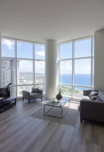 open Hawaii condo living area with large-format vinyl flooring